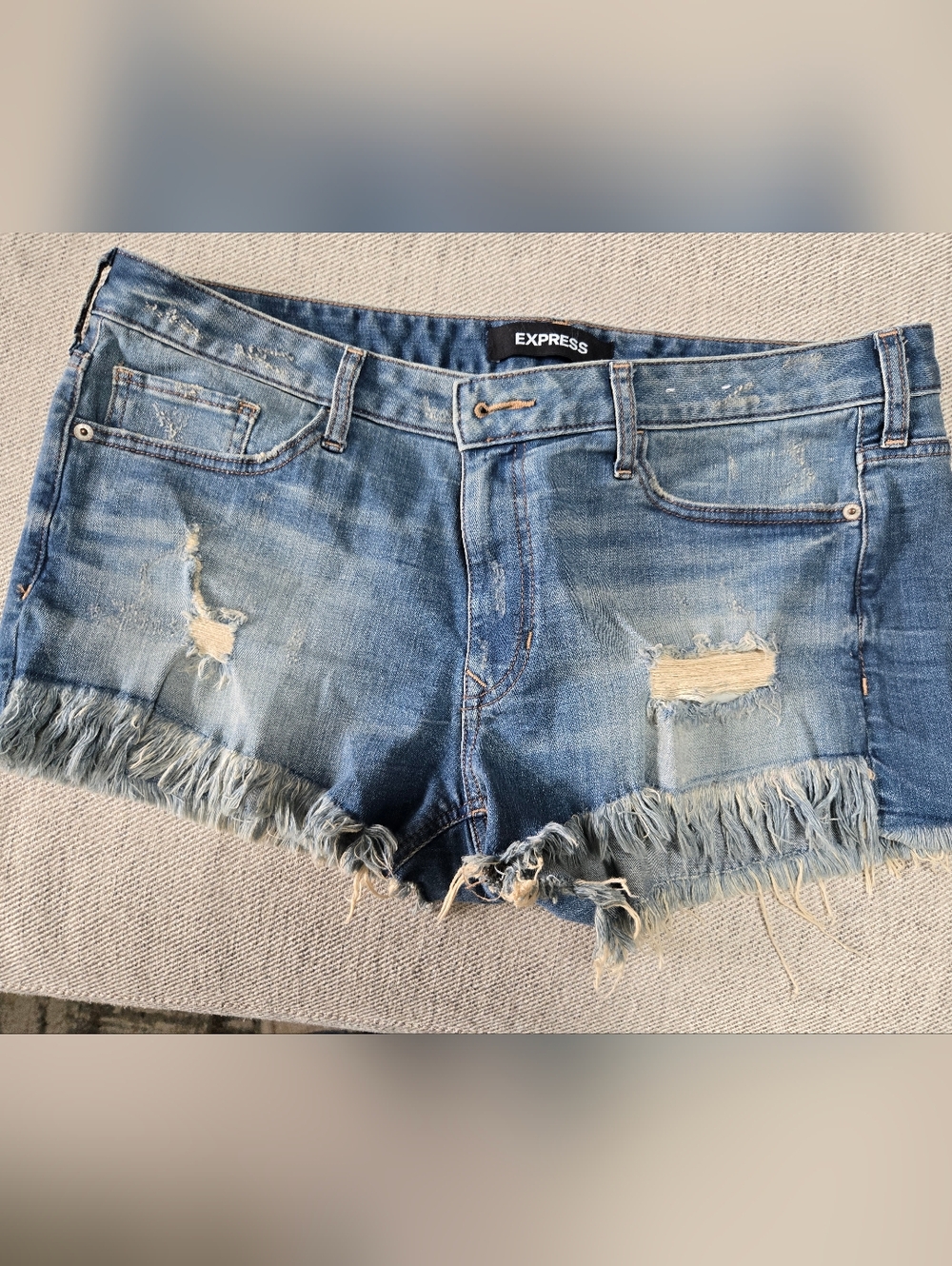 Express Shortie Low-Rise Distressed Light Wash Denim Shorts